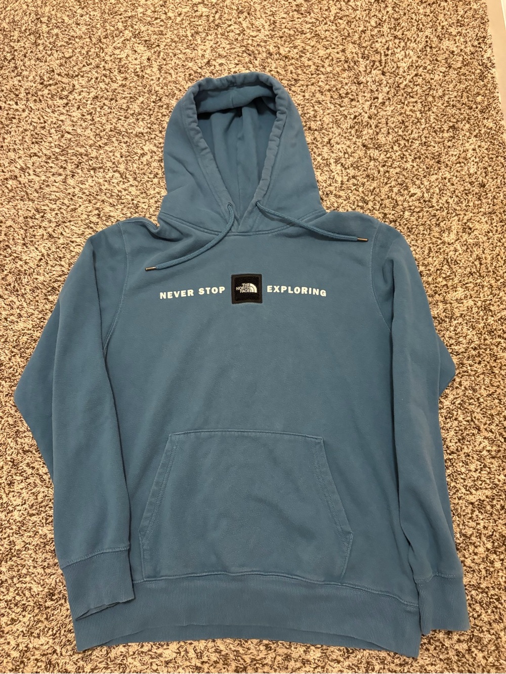 The North Face light blue pullover with black logo patch